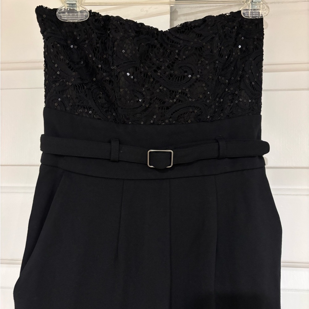 Chic strapless, belted  jumpsuit with sweetheart lace corset top